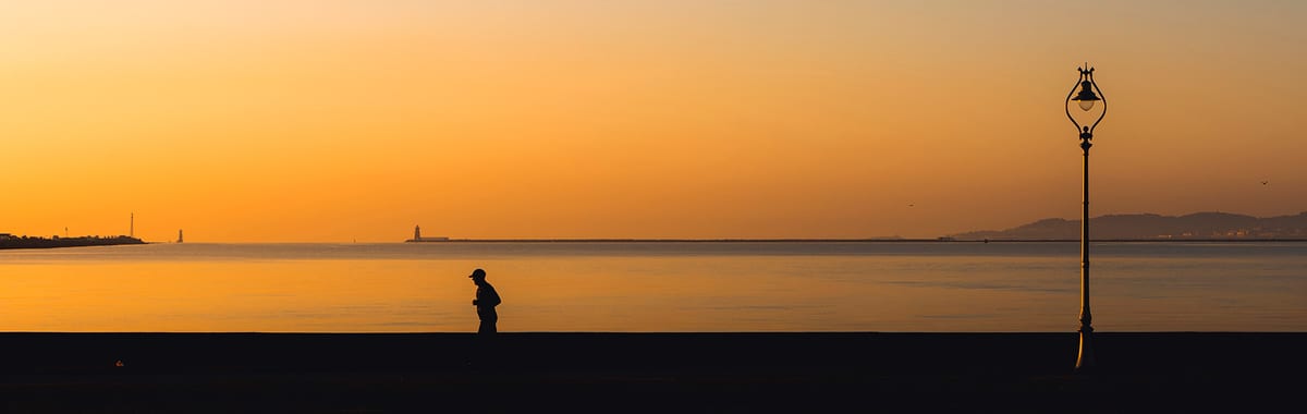 Early morning jogger running along the Clontarf seafront — Interiors photography, Dublin